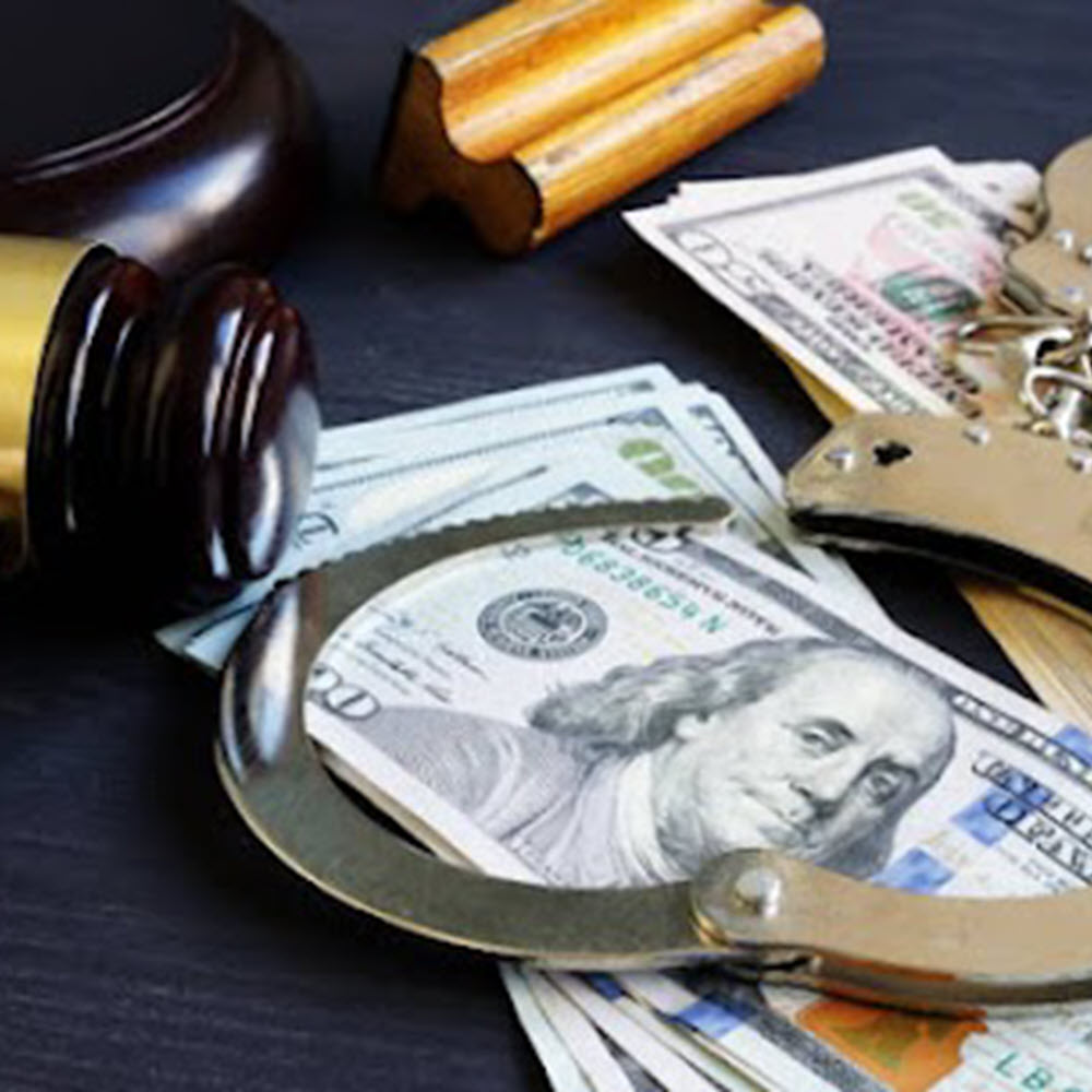 Open-Handcuffs-and-gavel-on-top-of-stack-of-20-dollar-bills